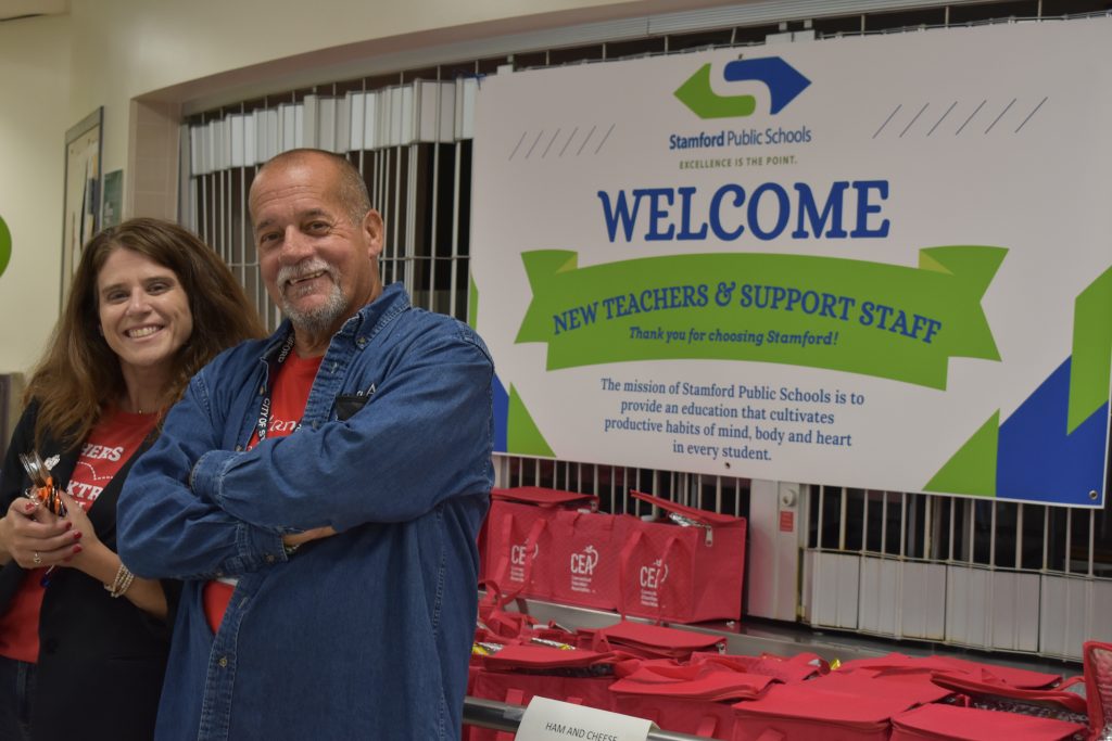 CEA Vice President Joslyn DeLancey and SEA President John Corcoran welcome more than 100 teachers to Stamford.
