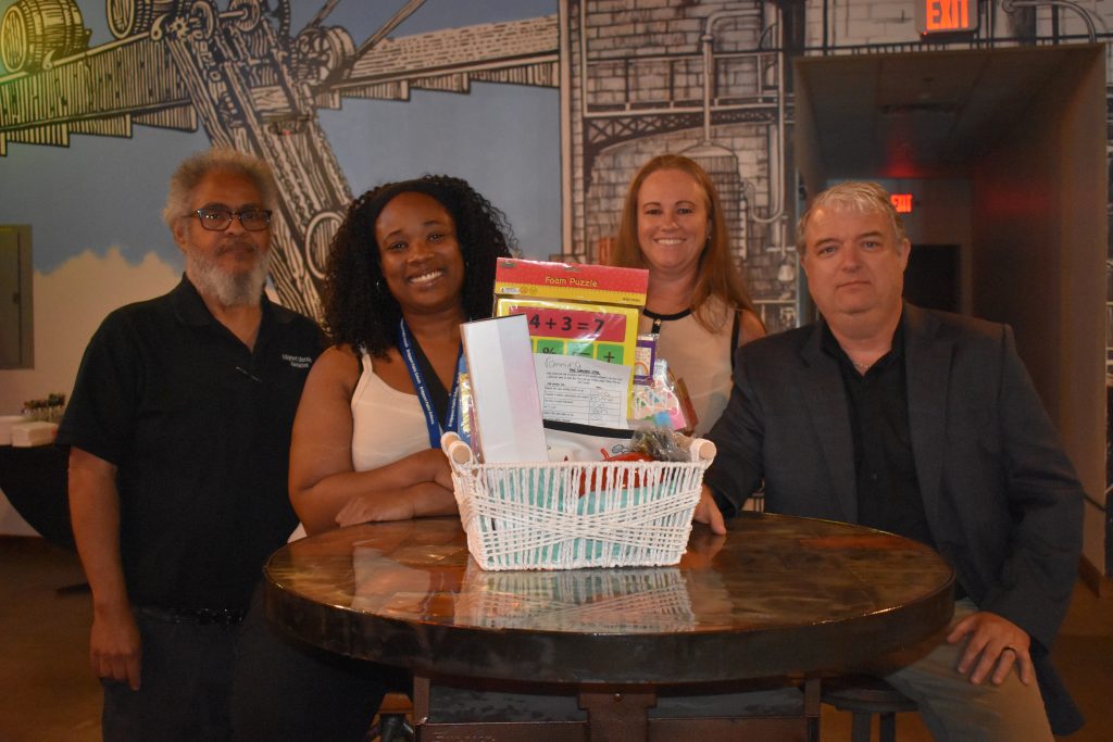 Prizes were part of the mix for Bridgeport's newest members, including Kannina Hampton, pictured with BEA Secondary Vice President Joe DeGroate, Vice President Jen Keleman, and President Jeff Morrissey.