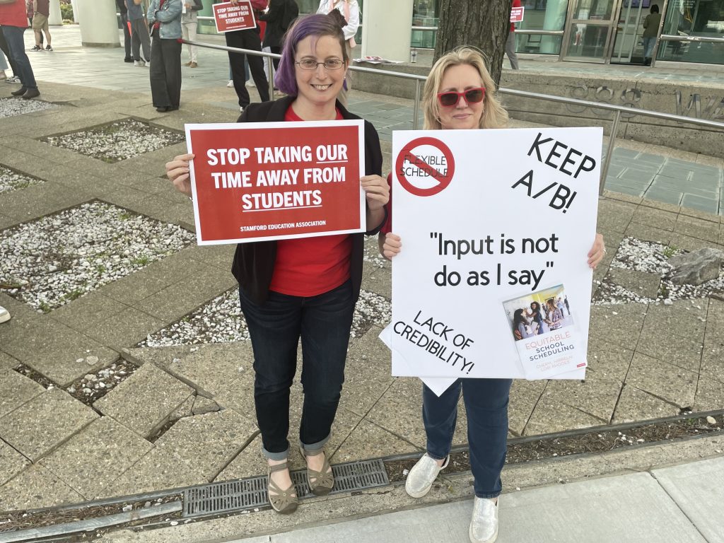 Stamford educators and parents stand side by side in support of a better schedule for students. 