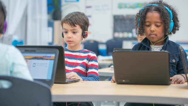elementary students on laptops, educational technology